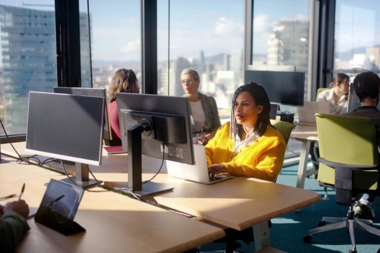 Skin Care South Africa office environment showing professionals working near large windows with daily indoor UV exposure and screen exposure effects on skin health